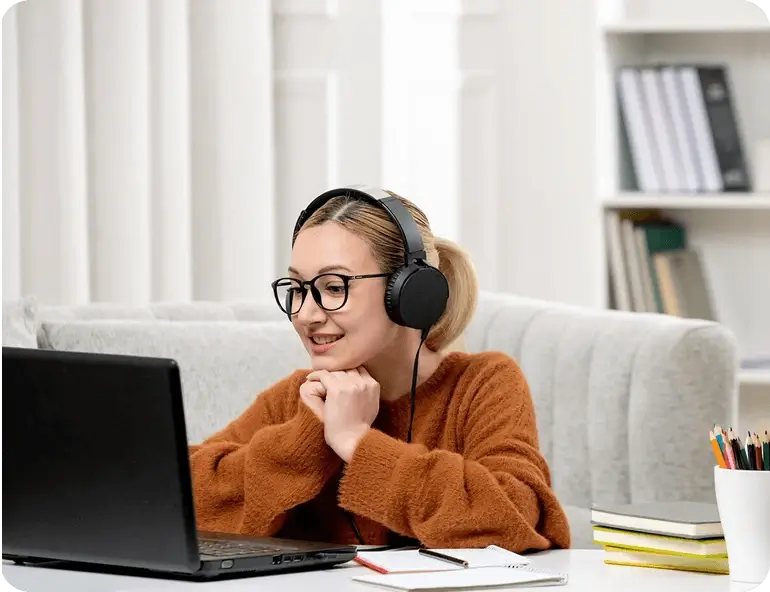 Student practicing PTE listening with headphones